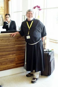Fr. Jeff is happy to finally get his lost luggage and return his borrowed habit that is much too short! Photo: ©capitulumgenerale2015