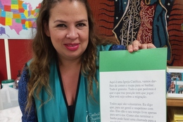 Volunteer Mayra Garza with a language "cheat sheet"