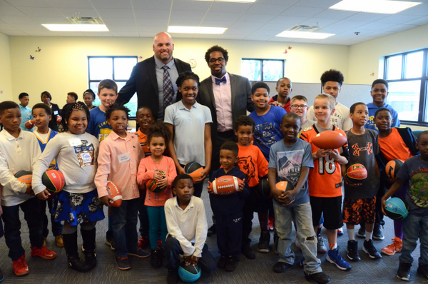 Cincinnati Bengal's Andrew Whitworth and Dhani Jones signed footballs for the Friars Club Kids.