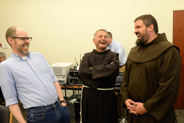 Br. John Barker jokes with fellow Franciscan friars Fr. Bob Bruno and Br. Colin King