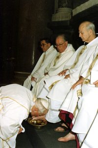 Pope John Paul II washing the feet of Fr. Cyprian