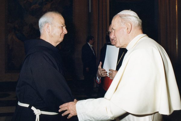 Fr. Cyprian Berens, OFM, greets Pope John Paul II in 1989