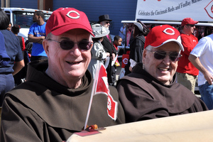 Fr. John Bok, OFM, & Fr. Blane Grein, OFM, ride in the rumble seat of a 1930 Ford Model A Roadster courtesy of Cobb Car Care