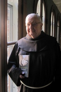 Fr. Hilarion Kistner, OFM, with his book, "The Gospels According to Saint Francis"