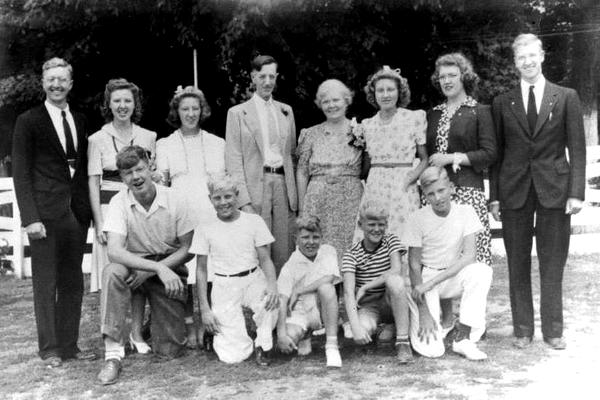 The Schneider family on the occasion of Otto and Anna's 25th wedding anniversary in 1941. Top row L-R: Victor (Fr. Bernardin, OFM) Marcella, Jeannette, Otto, Anna, Cecilia, Dorothy, Bertrand (Fr. Chris, OFM), Kenneth, Norbert, Raymond (Fr. Ric, OFM), Donald, Robert (Fr. Aquinas, OFM) 